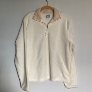 Cream, with beige collar & sleeves.  Pockets on both sides.  Soft plush material
